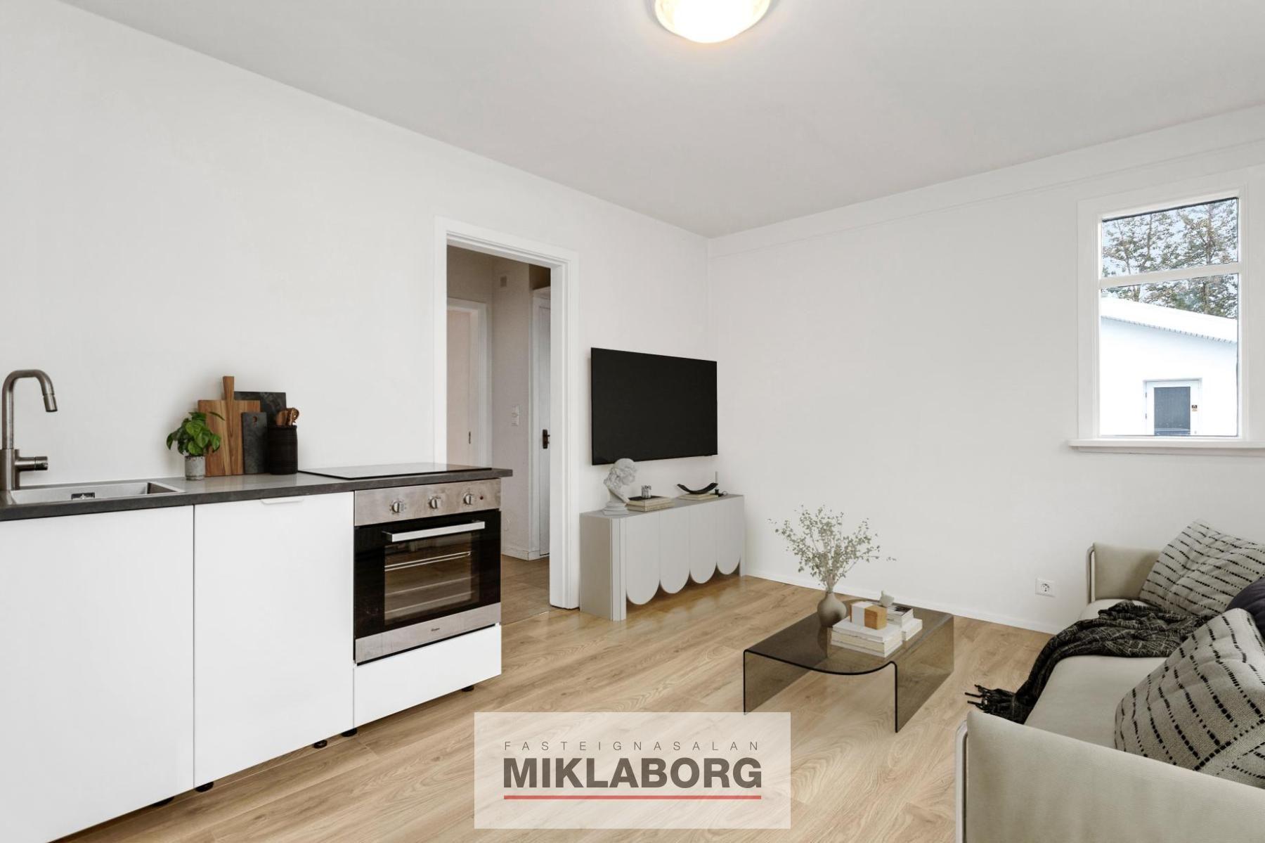 Living room sofa on the right and sofa table and then tv on the small corner wall_final.jpg