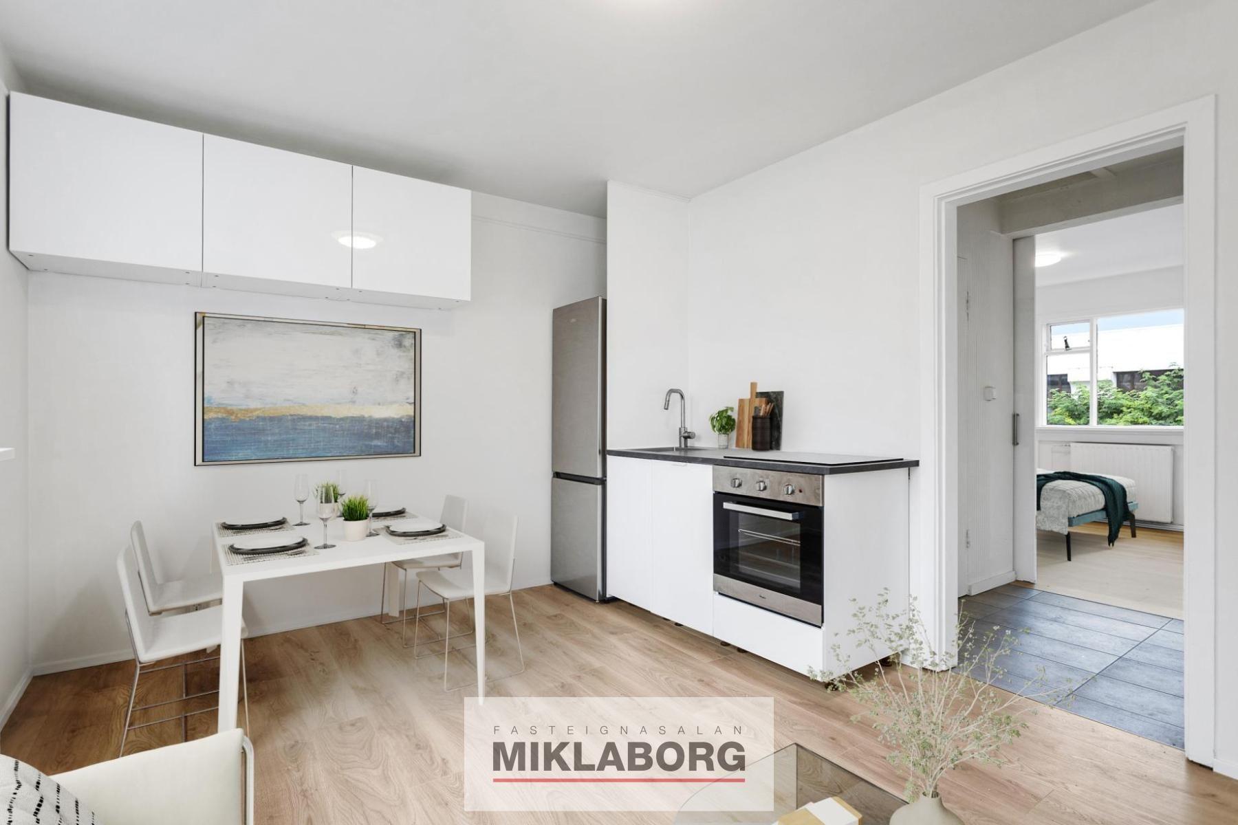 Kitchen table and chairs by the far center wall_final.JPG